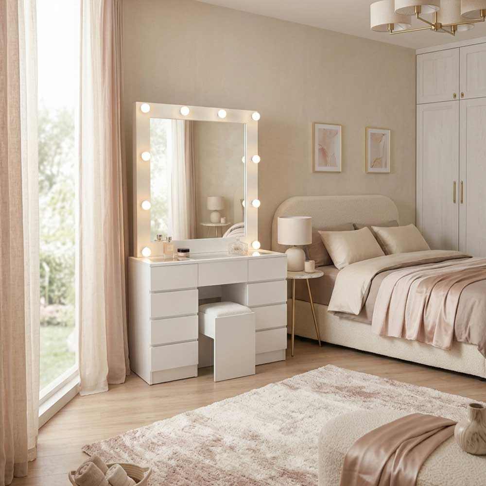 Neatly arranged bedroom with a vanity table, mirror, and bed.