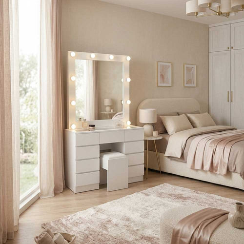 Neatly arranged bedroom with a vanity table, mirror, and bed.
