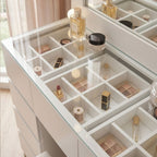 Makeup organizer with various cosmetic items on a white surface