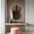 Wooden vanity with mirror and pink stool against a neutral wall