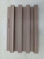 Wooden panel with 'KRO33' branding on a light wooden surface