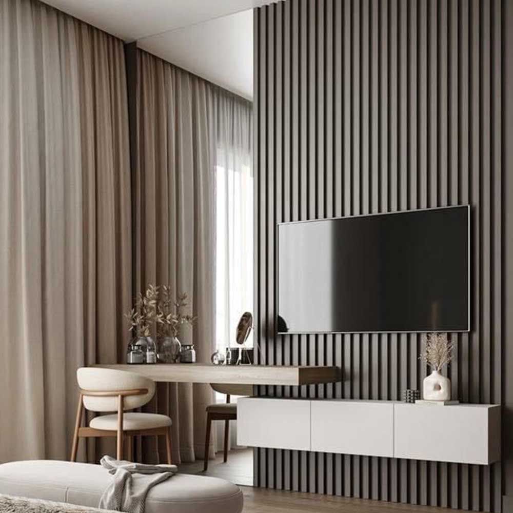 Modern living room with a TV mounted on a textured wall, a white console table, and decorative items.