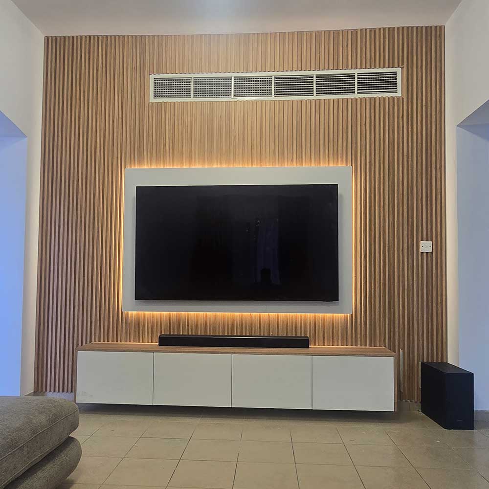 Modern living room with a television mounted on a wooden wall