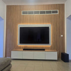 Modern living room with a television mounted on a wooden wall