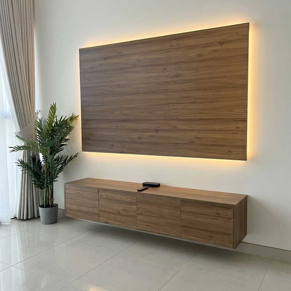 Wooden TV cabinet with a large wooden panel above it in a modern living room.