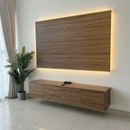 Wooden TV cabinet with a large wooden panel above it in a modern living room.