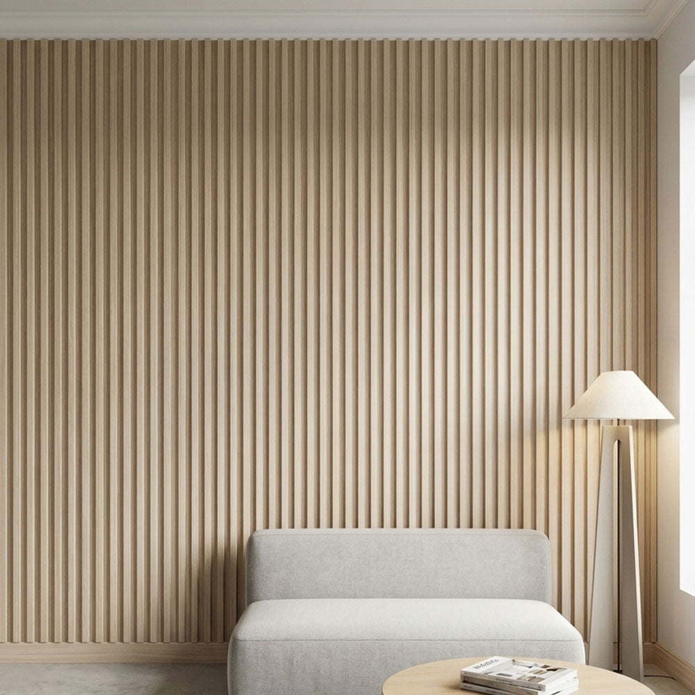 Beige striped wallpaper with a gray sofa and lamp in a room.