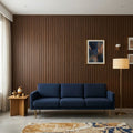 Ble Velvet sofa in front of Dark wood fluted Pvc Panels