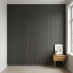 Modern room with a textured black wall and wooden side table.